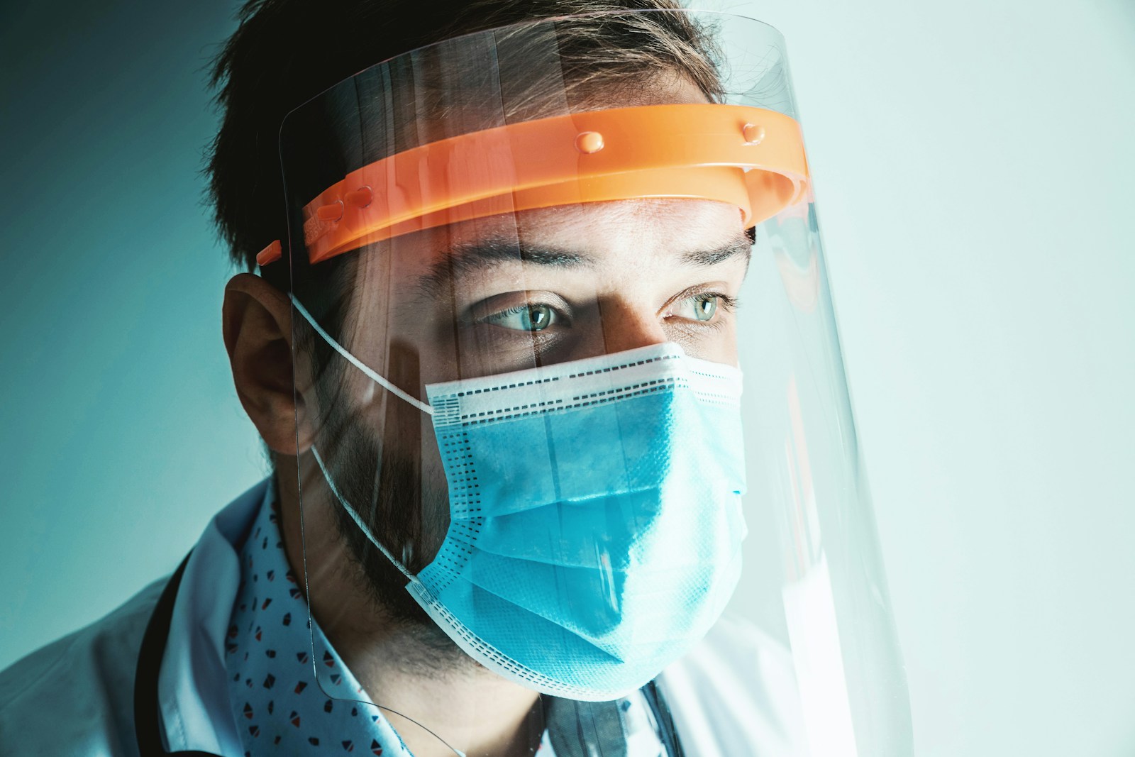 doctor wearing mask and medical grade face protector
