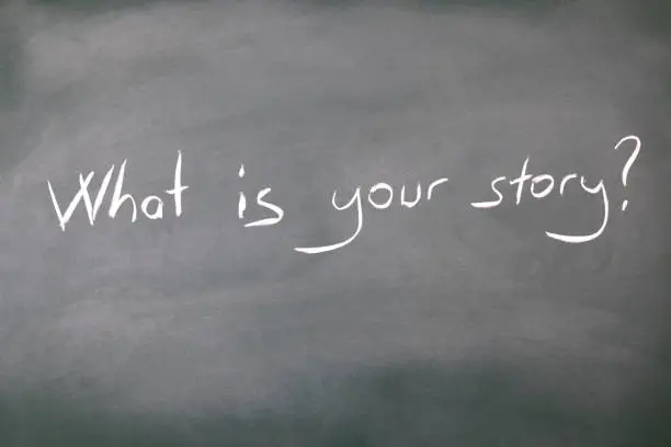 What is your story? written in chalk on a blackboard