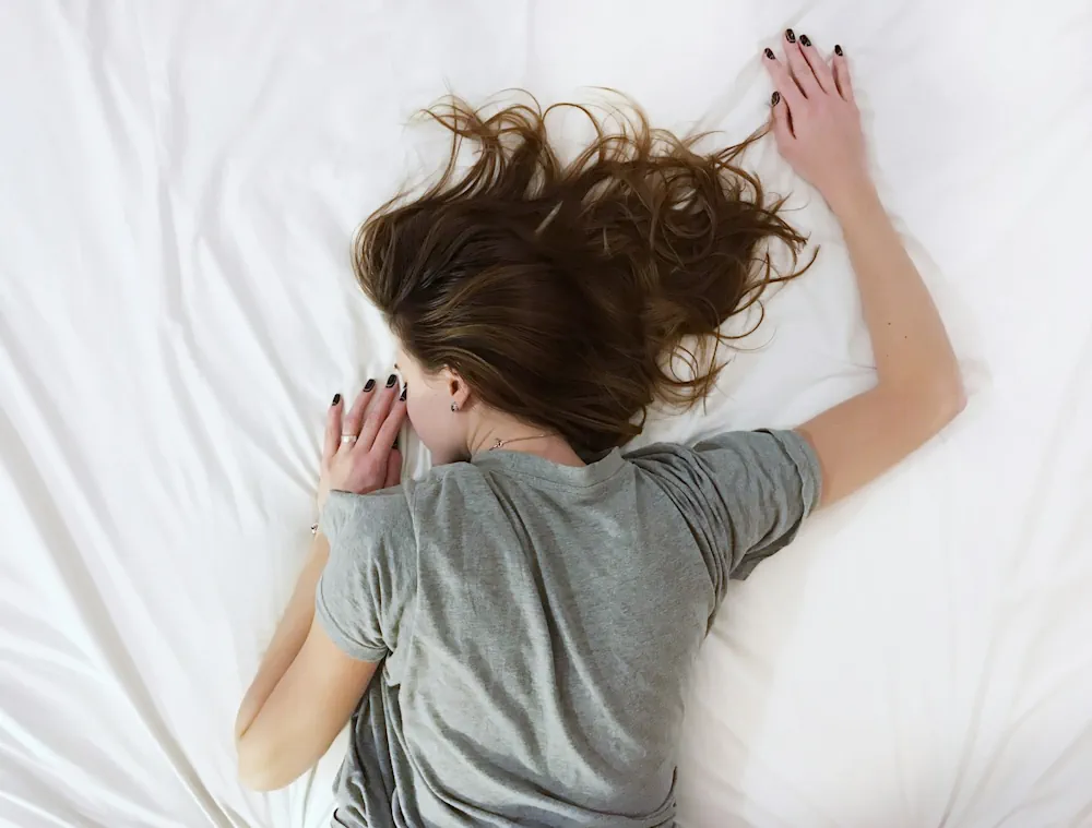 Woman Laying on Bed